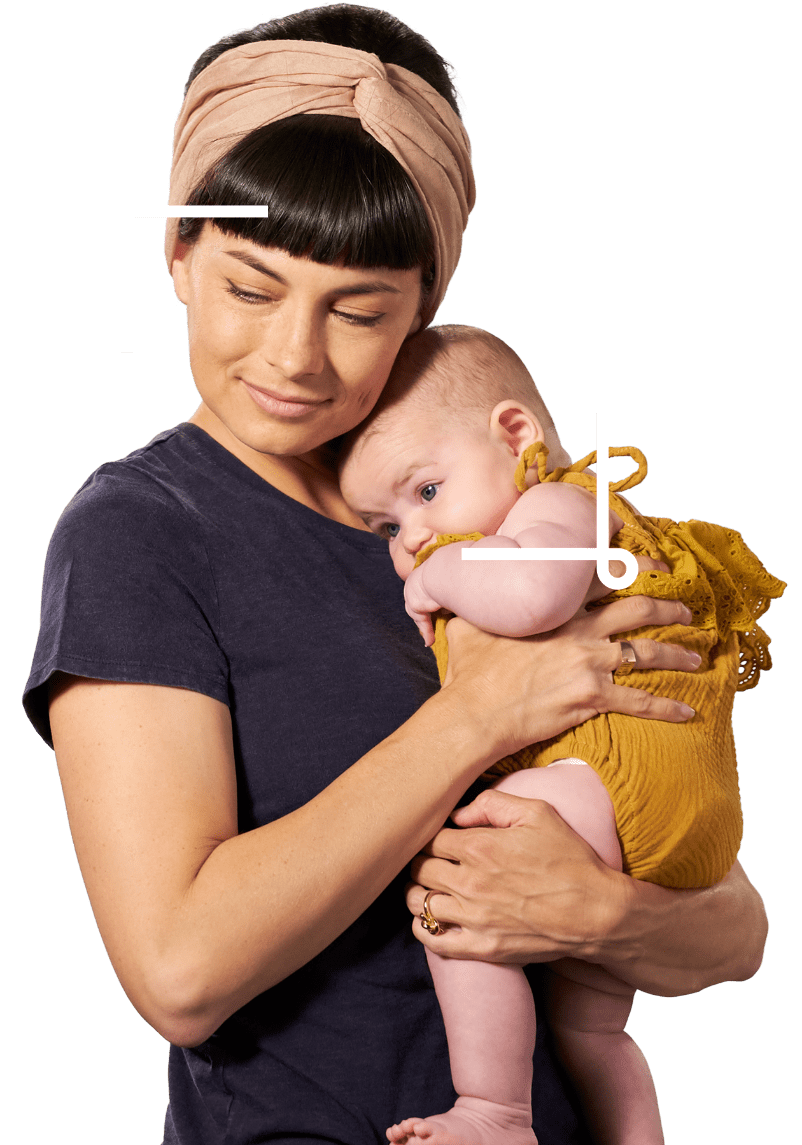 Savvy mom holding cute baby in a yellow dress